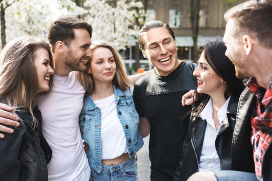 Group Of Best Friends Are Having Fun Outdoors. Young People Are Happy To See Each Other During A Meeting.