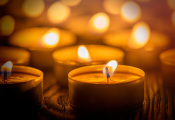 Many burning candles with shallow depth of field