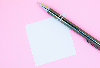 Blank white To Do List Sticker with pen. Searching information on the Internet..Close up of reminder note paper on the pink background. Copy space. Minimalism, original and creative. 
