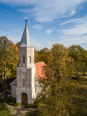 Fototapeta premium Aerial view of Renda lutheran church in sunny autumn day, Latvia.
