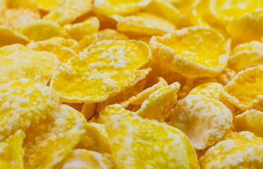 Yellow Cornflakes close up photo, Food texture background, top view. Macro shot. Perfect breakfast.