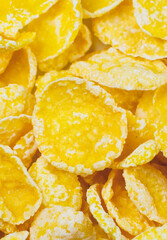 Yellow Cornflakes close up photo, Food texture background, top view. Macro shot. Perfect breakfast.
