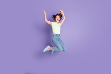 Full length body size view of lovely glad skinny cheerful girl jumping having fun isolated over violet color background