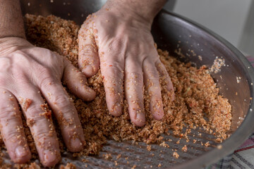 Close up of man hands, kneading raw meatballs in kneading tray. authentic anatolian food, 