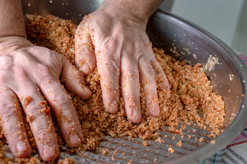 Close up of man hands, kneading raw meatballs in kneading tray. authentic anatolian food, 