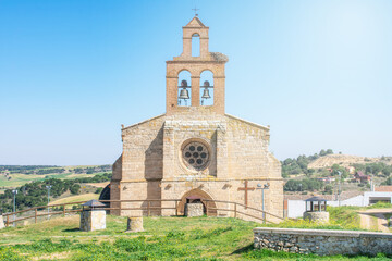 Fototapeta na wymiar front view of a stone church in Castilian village in Spain