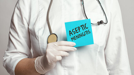 Cropped view of doctor in a white coat and sterile gloves holding a note with words - Aseptic...