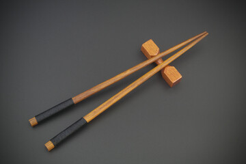 Chopsticks on black background close-up.