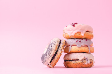 Tempting donuts dessert with iceing and sprinkles. Sweet sugar round doughnuts of different flavours. Top horizontal view copyspace. Healthy diet and junk food concept