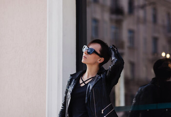 Lifestyle fashion woman posing on street