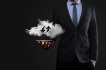 Cloud technology. Polygonal wireframe cloud storage sign with two arrows up and down on dark ....