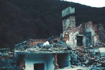 Ruins of the destroyed building in the mountains.