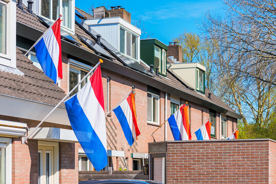 Dutch Flags hanging outside houses in Alkmaar, Netherlands to celebrate King's Day on April 27, a national Holiday in The Netherlands