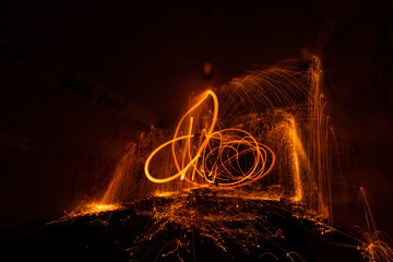 Steel wool shapes swirl light effect in a abandoned tunnel