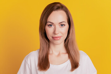 Close-up of a woman smiling good mood look camera on yellow background