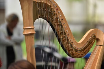 harp with hands playing musician during a classical music concert 