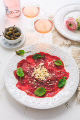 Beef carpaccio with capers and parmesan cheese