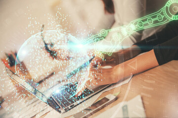 Double exposure of woman hands working on computer and data theme hologram drawing. Tech concept.