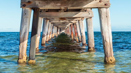 Marion Bay view from under jetty at sunset time during summer season, Yorke Peninsula, South Australia