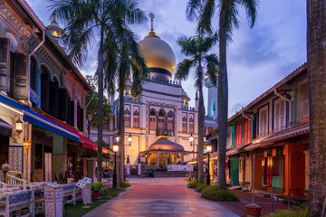 Illuminated Arab street and Masjid Sultan Mosque with no people during city lock down at Kampong...