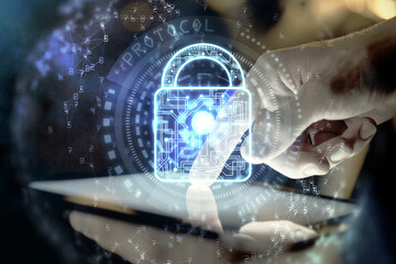 Multi exposure of man's hands holding and using a digital device and lock drawing. Security concept.