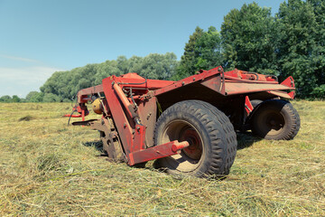 Red plow in the field. 
