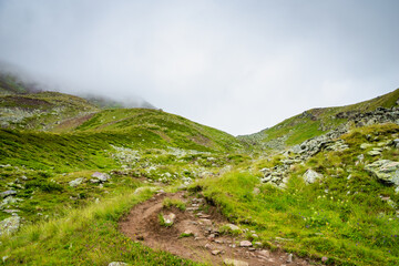 highland mountain landscape with copy space - nature, outdoor, adventure, trekking, hiking, mountaineering concept image in mount Kazbegi, Georgia
