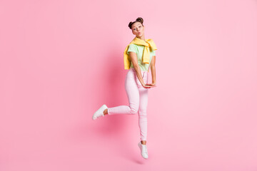 Full size photo of happy cute charming woman wear tight jumper good mood jump isolated on pastel pink color background