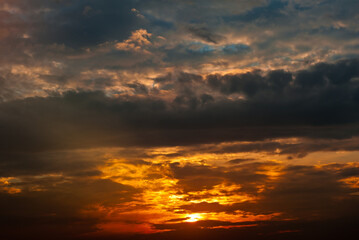 Beautiful summer sunset sky, yellow clouds