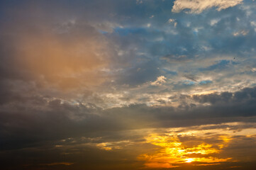 Beautiful sunset sky, yellow clouds