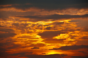 Naklejka na ściany i meble Beautiful sunset sky, yellow clouds