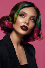 Beautiful woman with multi-colored hair and bright make up and hairstyle.
