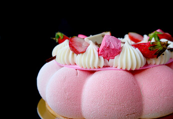 Closeup a Pastel Pink Strawberry Mousse Cake Isolated on Black Background