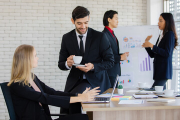 A group of diverse businesspeople working together in a modern office in an intimate manner. Idea for teamwork and good business colleagues.