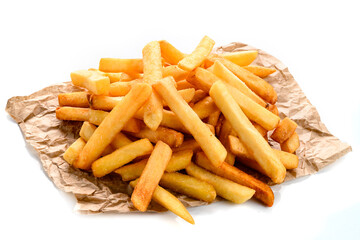 Fast food french fries potatoes with skin served with salt and herbs on baking paper