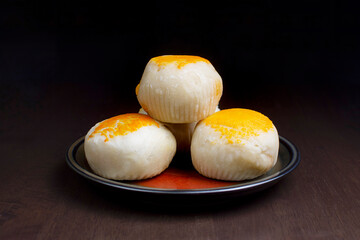 Moon cake,Chinese pastry with salted egg in plate on wooden table