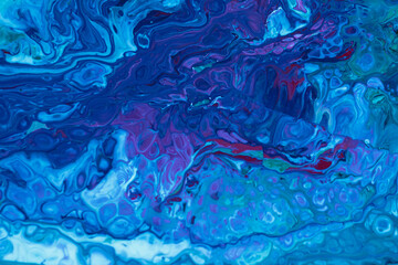 Blue fluid. Improvisation of the ocean with paint. Blue marble.