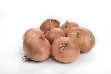 Yellow vegetable onions on a white background