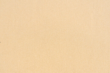 Fototapeta na wymiar Sand texture background on the beach. Light beige sea sand texture pattern.