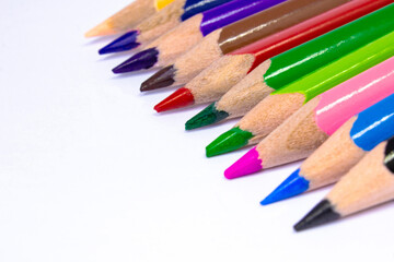 Close up macro shot of color pencil pile pencil nibs, used pencils from a school art room.