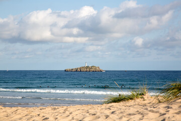 Obraz premium Somo Beach with Mouro Island and Lighthouse; Santander