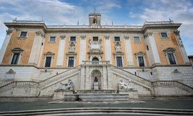 Obraz premium Rome, Italy. Senatorial Palace, municipal building on Roman foundations with bell tower and Michelangelo elements in hilltop square Piazza del Campidoglio.