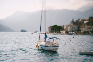 Tilt-shift effect - sailing yacht moored in Perast, Montenegro.