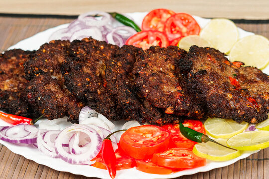 chapli kabab desi Pakistani food display in a plate 