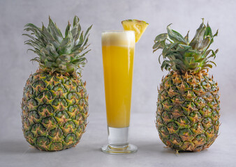 Refreshing freshly made fruit juice on a glass , fresh pineapple juice.