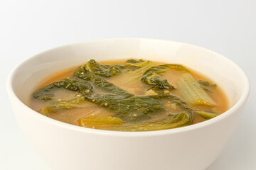 Young cabbage miso soup on a white background