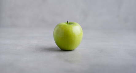 Fresh single Green Apple Isolated on Gray Background.