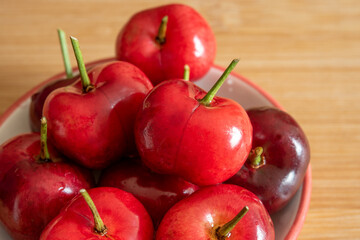Fresh cherries over a wooden surface
