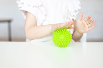 Child training tactile system with relief ball.