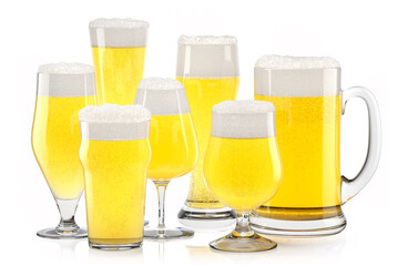 Set of fresh light beer glasses with bubble froth isolated on white background.